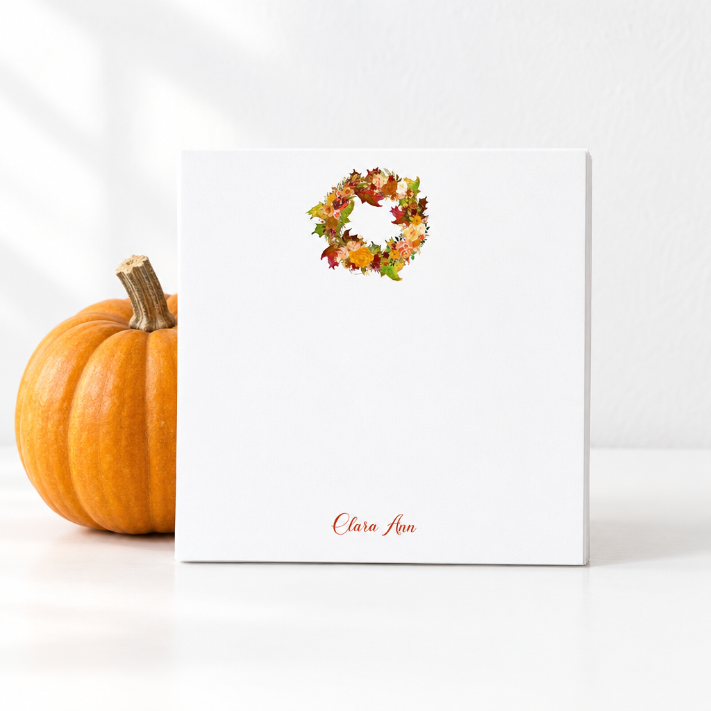 Fall Wreath notepad propped against a pumpkin