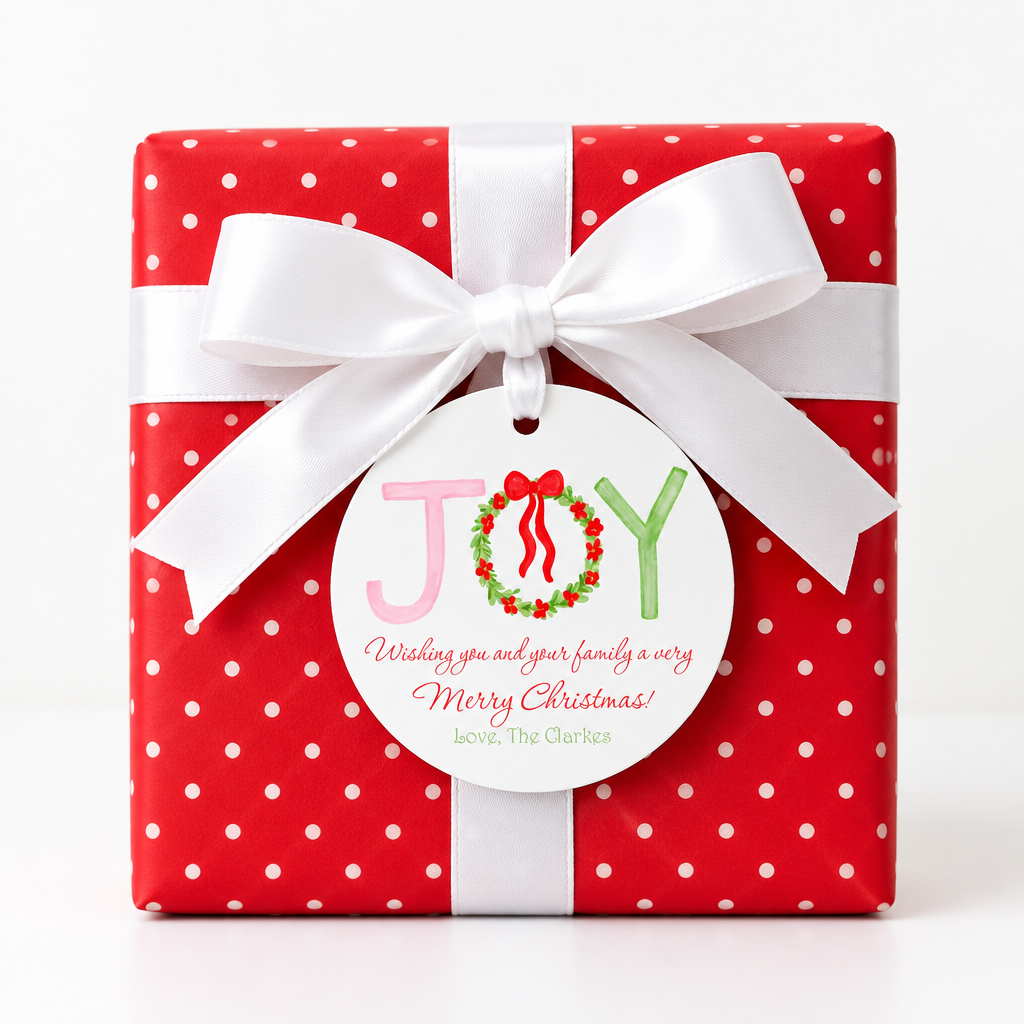 JOY gift tag on a red polka-dot present