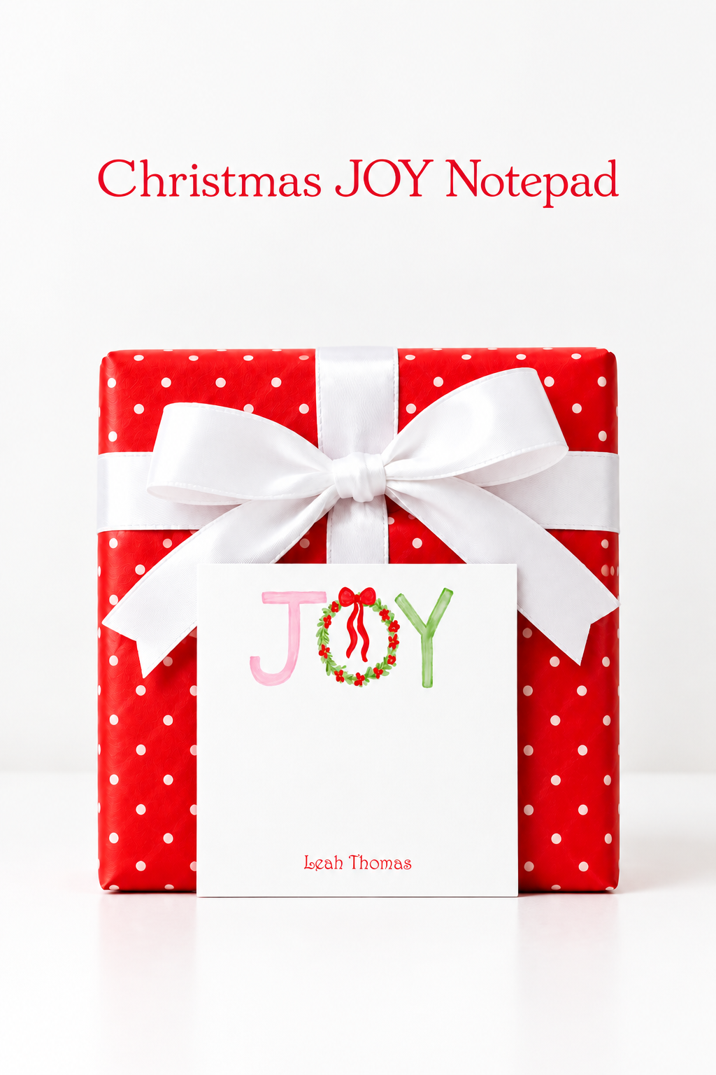 Pinterest portrait of the Christmas JOY notepad against a red polka-dot present